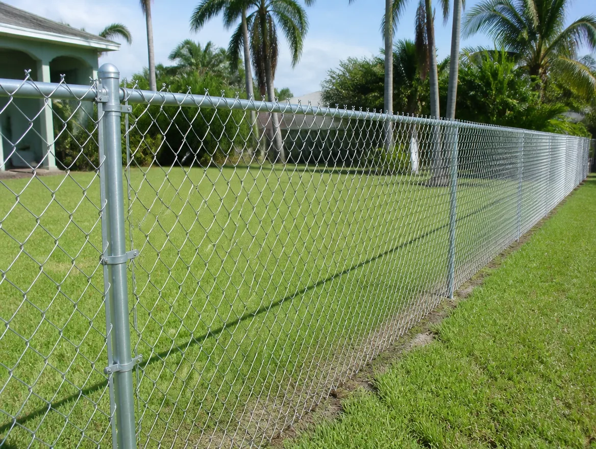 Galvanized chain link fence with silver mesh and a top rail